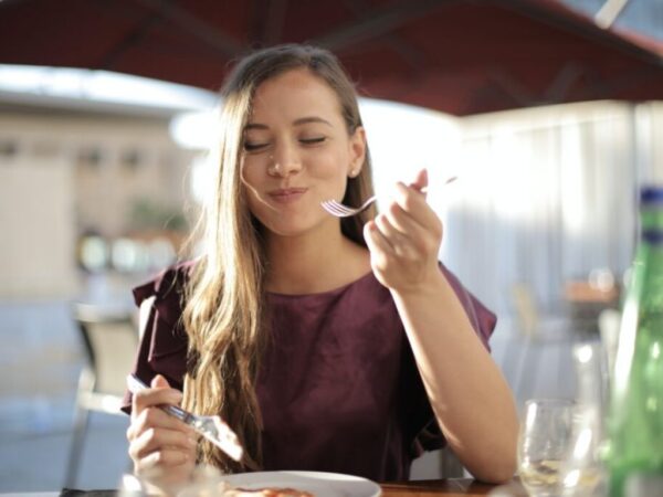 Woman taking a bite of food