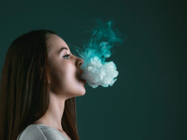 Girl blowing smoke out her mouth