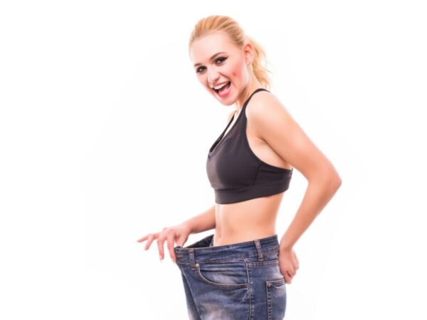 Blonde Women pulling her pants out at waistline